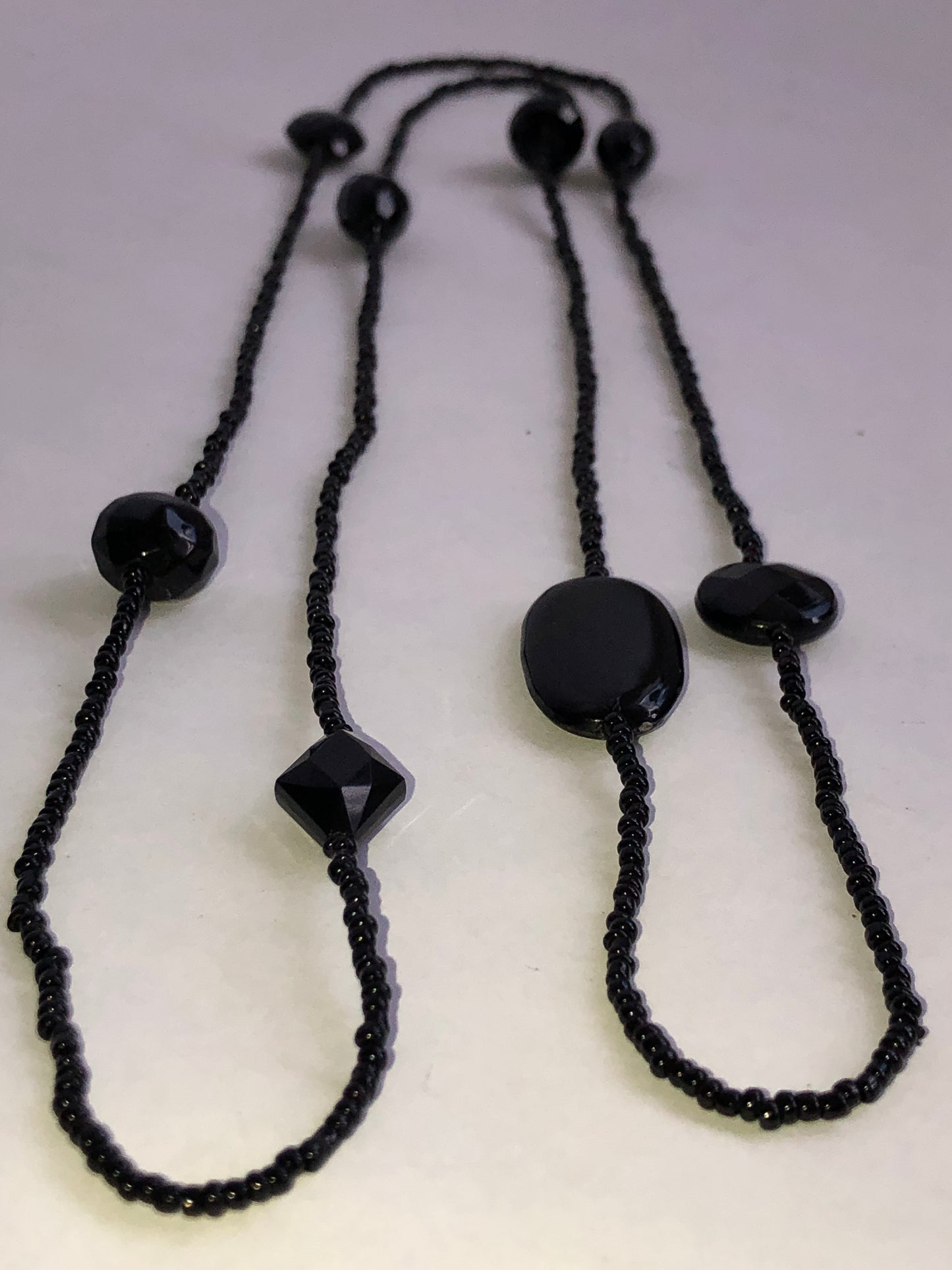 Long Black Seed Bead Necklace with Multi-Shape Glass Accents
